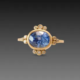 Oval Sapphire Ring with Diamond Trios